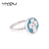 Hot sale stainless steel round shaped sky blue ink cross finger ring with 3 crystal