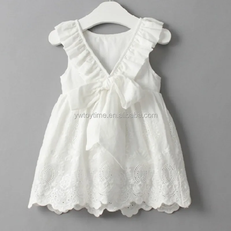 baby girl in white dress