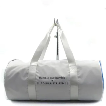 white canvas duffle bag