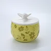 wholesale Factory direct sale household little things yellow Round ceramic covered jars with butterfly shape lid