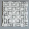 Grey diamond,trapezoidal and Carrara white squares spliced to create a plane of distorted vision marble mosaic for the wall