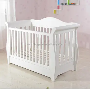 white wooden cot