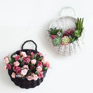 Image of wholesale hanging rattan flower pot with plastic liner for sale in bulk