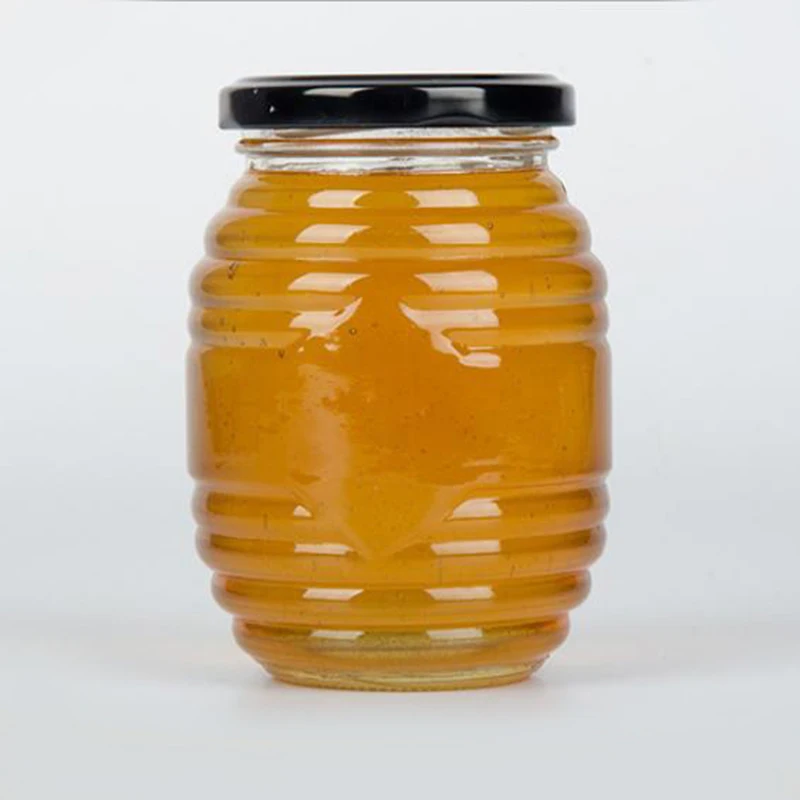 Glass jar for honey Oval glass honey bee bottle with tinplate screw lid