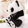 Giant panda with plush stuffed animal doll holds a bamboo panda