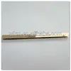 Flat metal bar tops for handbag corner
