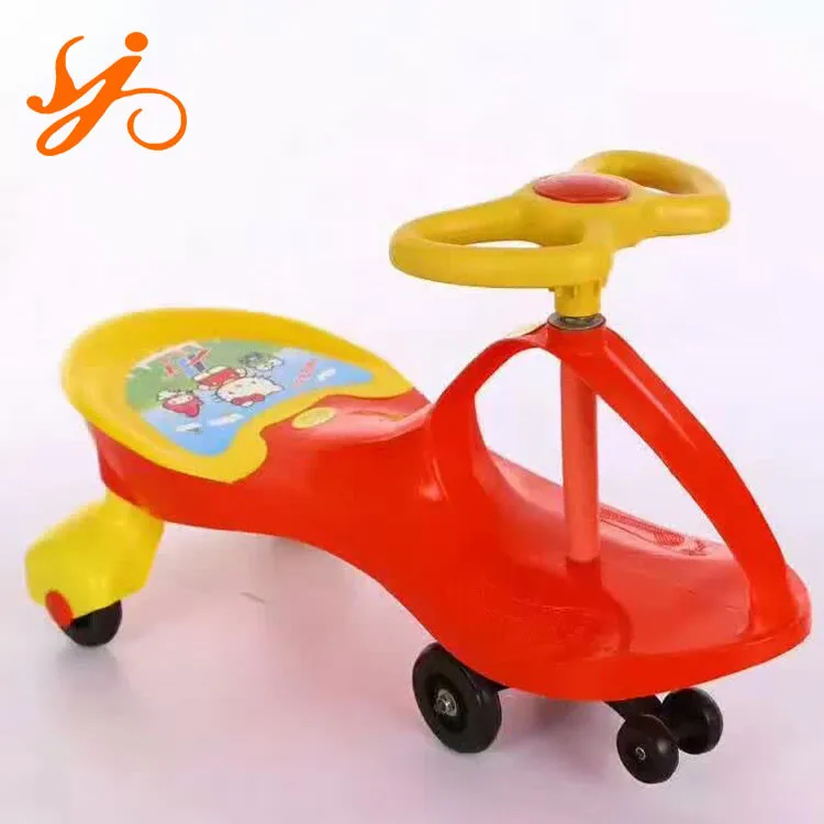 red and yellow plastic pedal car