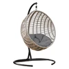 Hanging egg chair with cushion and stand on island patio