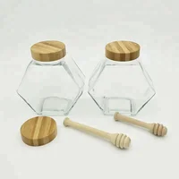 

Fancy Design Hexagon 700g glass honey jar with wooden lid and wooden dripper