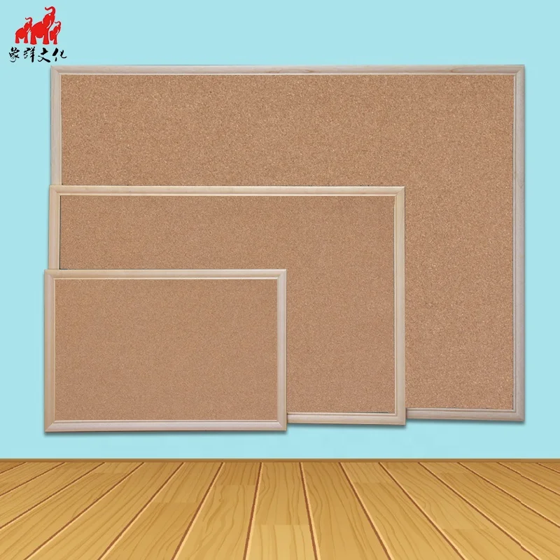 
Staples cork board with wood color frame on wall for sell 