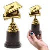 Free Sample Customized Wholesale Cheap Hot Selling Plastic Golden Graduation Cap Award Trophy for Promotional Gift