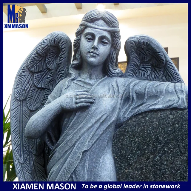 antique weeping angel tombstone with cemetery headstone for