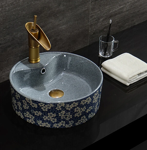 grey and blue ceramic wash basin