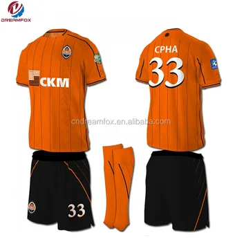 black and orange soccer jersey