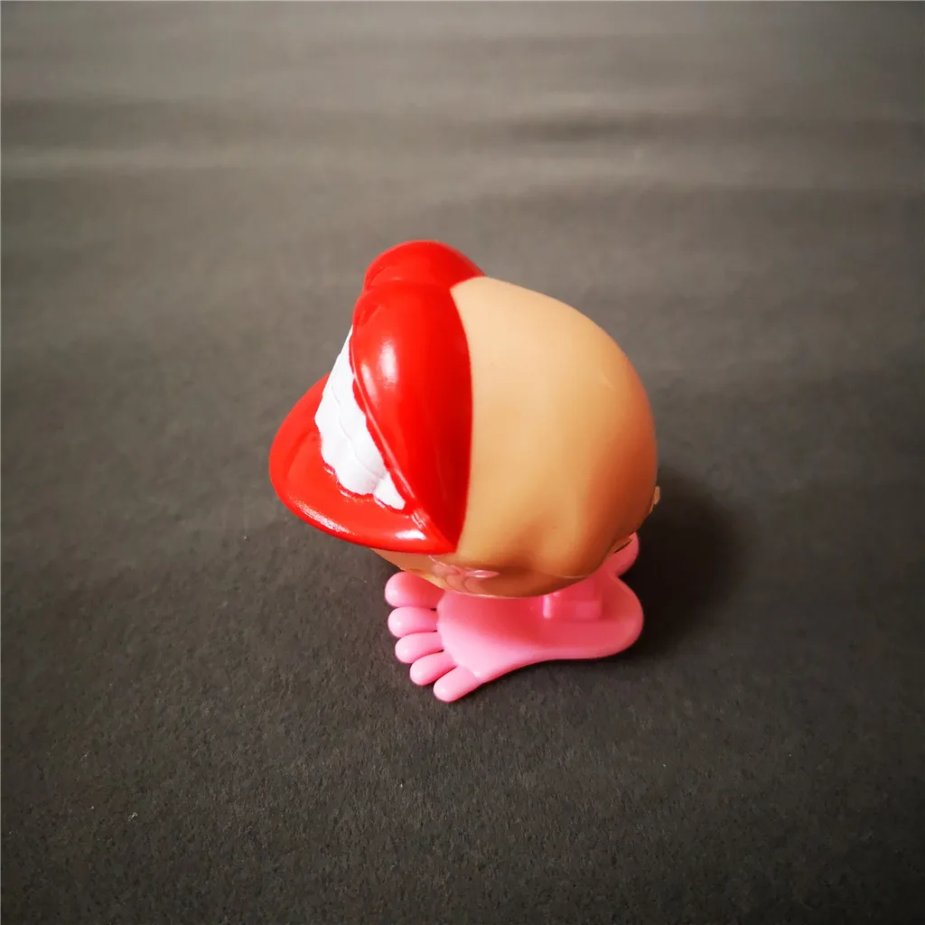 Jumping Wind up chain red lips teeth Dancing toys