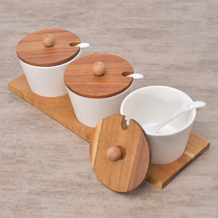 Hot sale kitchen used white ceramic spice pots seasoning pot spice jar with wood stand .jpg