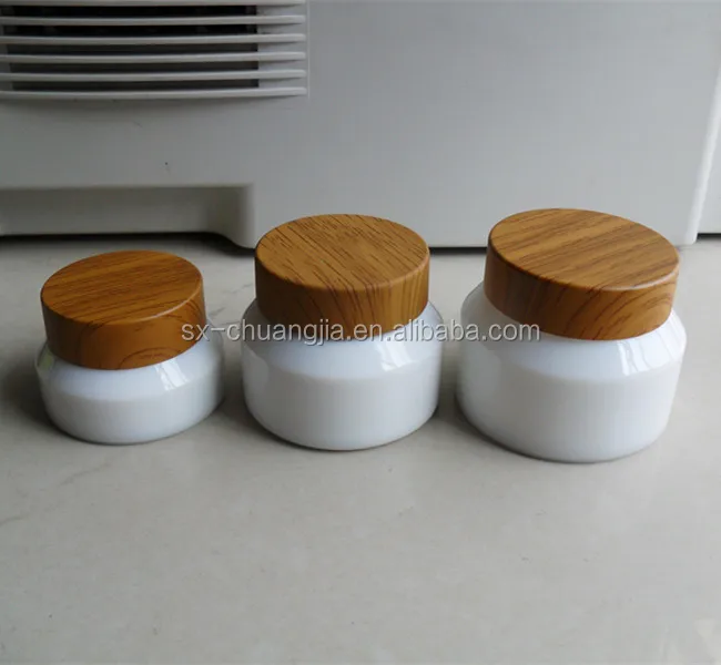 

cosmetic packaging opal white cream glass jar with bamboo like lid