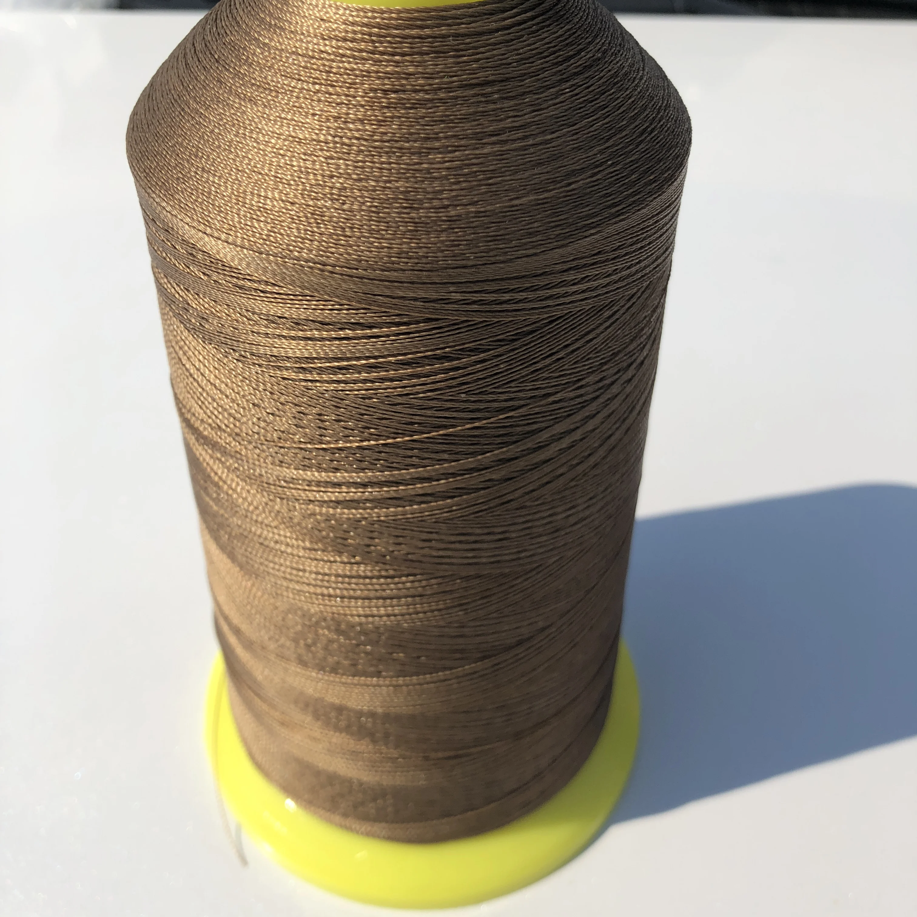 

ptfe coated fiberglass sewing thread high temperature chemical corrosion resistance for high temperature use in industry, Brown;off-white
