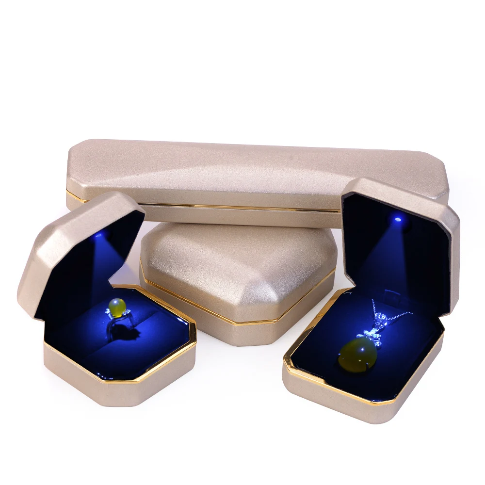 Black Velvet Jewelry Gift Box With Gold Trim Around The Cover The Base