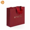 /product-detail/china-manufacture-wholesale-custom-designs-handmade-garment-packaging-red-fancy-shopping-paper-bag-60711892111.html