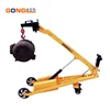 Portable folding boom loading and unloading truck