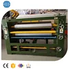 Glue spreader with automatic board feeding and flipping device