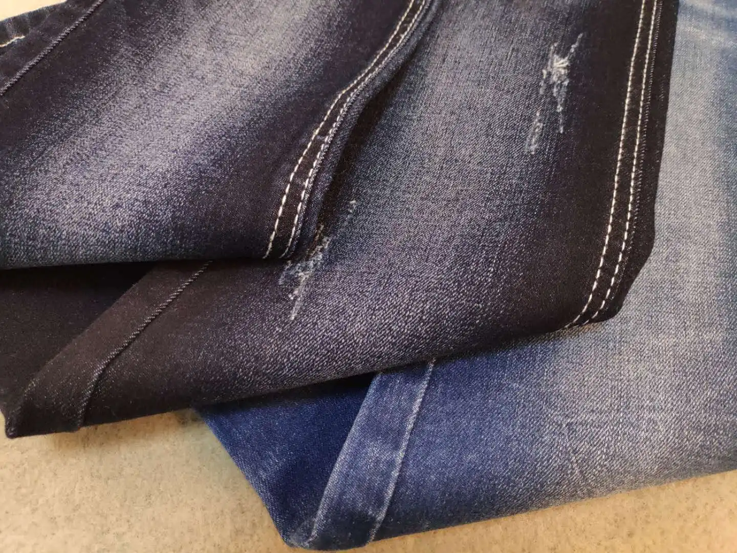 Closeup denim jeans texture. Stitched textured blue jeans denim fabric  background. Old grunge vintage denim jeans. Stock Photo | Adobe Stock