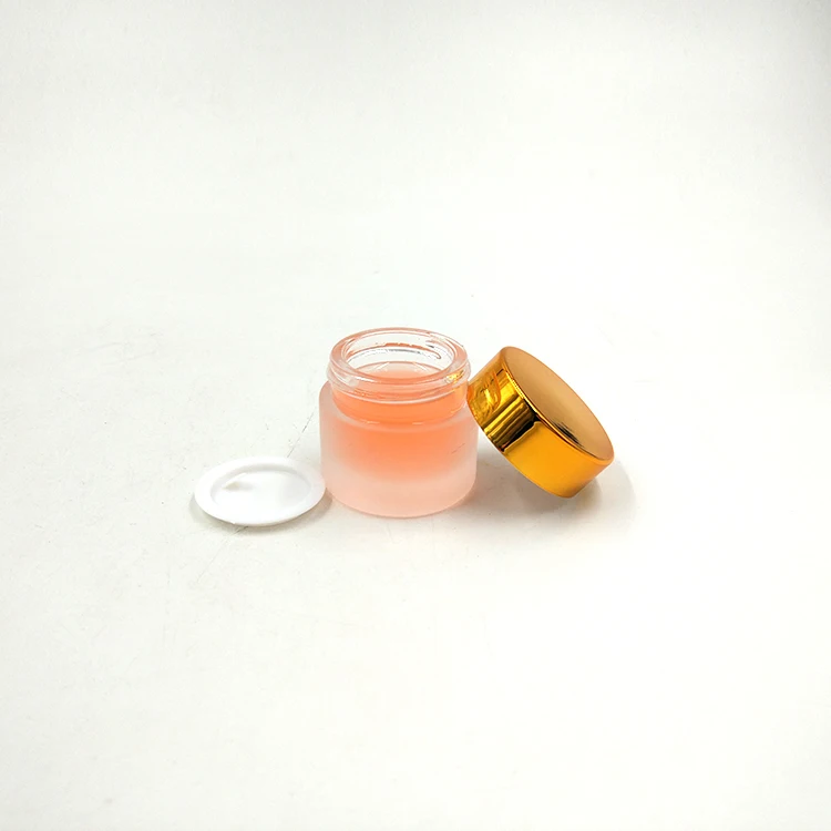 Sample size straight side 8g glass cosmetic jar with matte surface handing