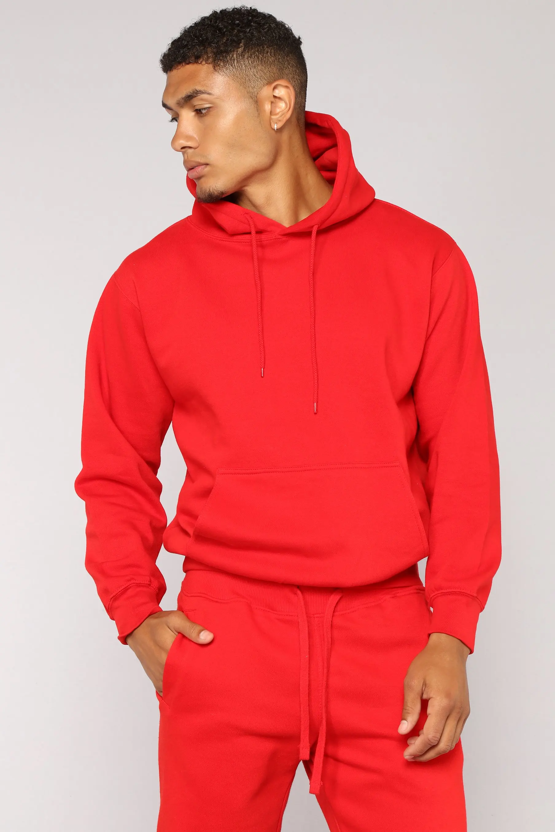 red joggers and hoodie