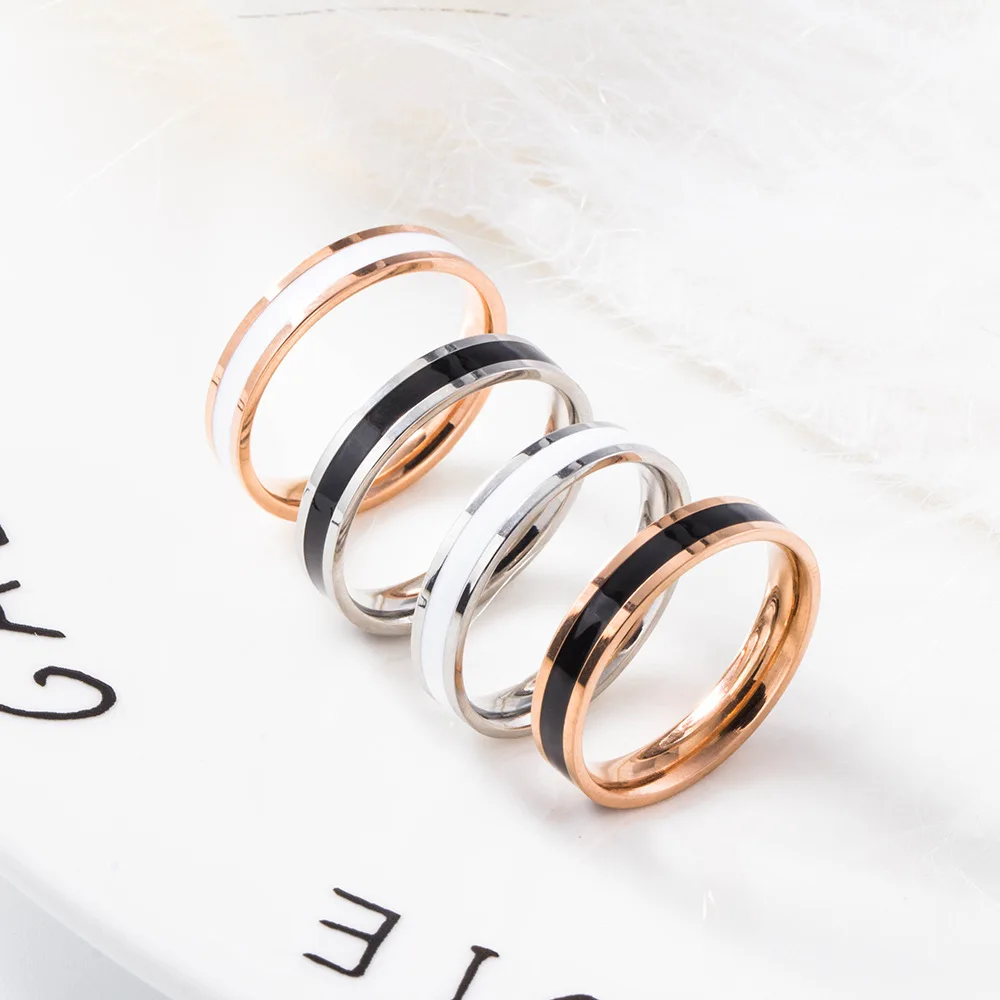 

New Japan and South Korea fine black and white Epoxy couple ring simple fashion lovers titanium steel ring, Steel rose gold