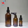 solid amber glass essential oil bottle with black pipette dropper top