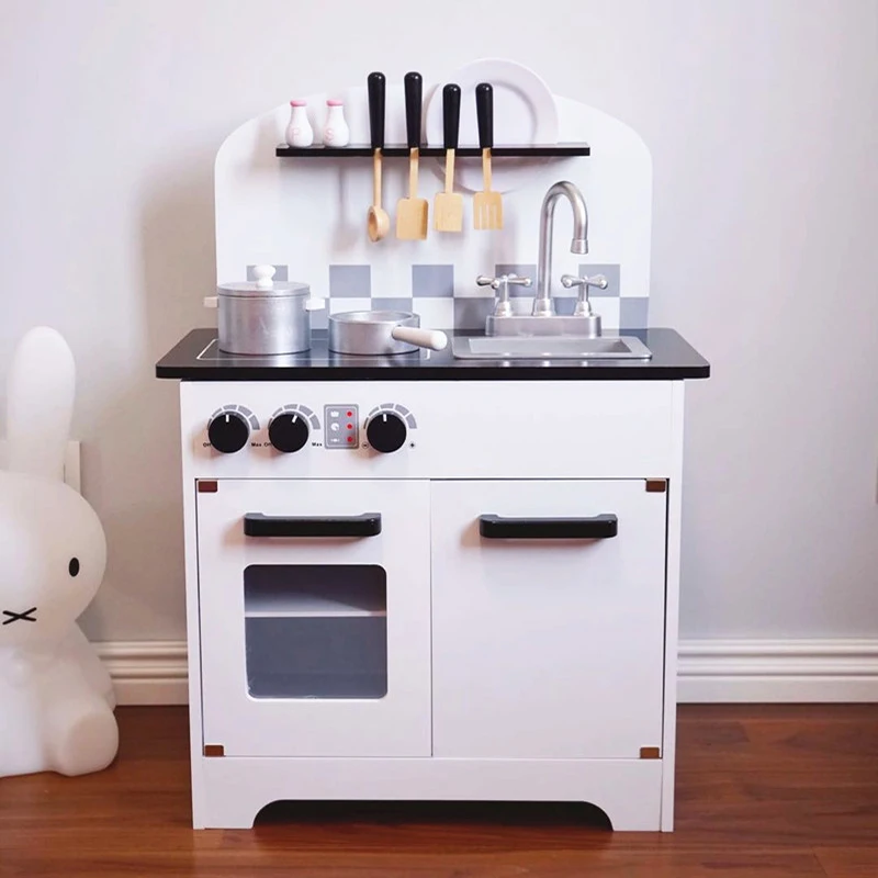 white wooden toy kitchen