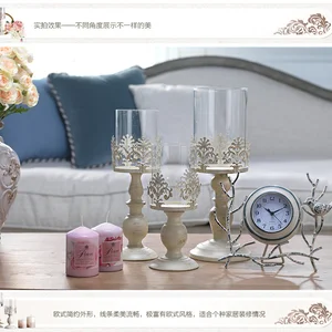Image of European style long-stemmed glass iron candleholder