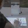 Touch mini projector turns a wall into a touch screen