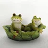 Double relaxing frog on the boat resin statue with floating function