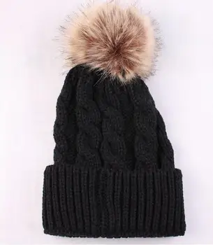 knit hat with fur ball on top