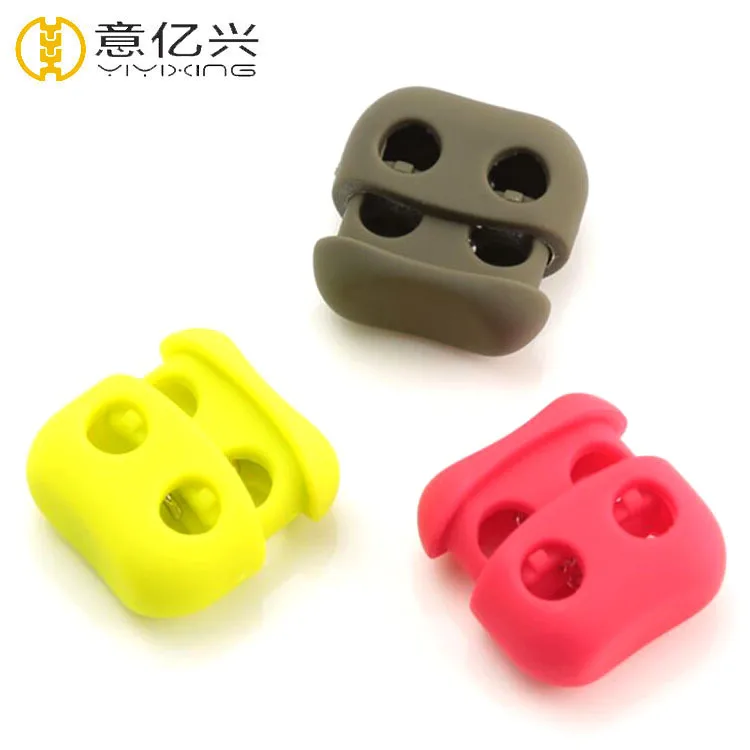 

Ecofriendly Plastic Double Holes Pig Nose Cord Stopper For Garment And Bags, Black, white, red, blue, green, purple etc as per order