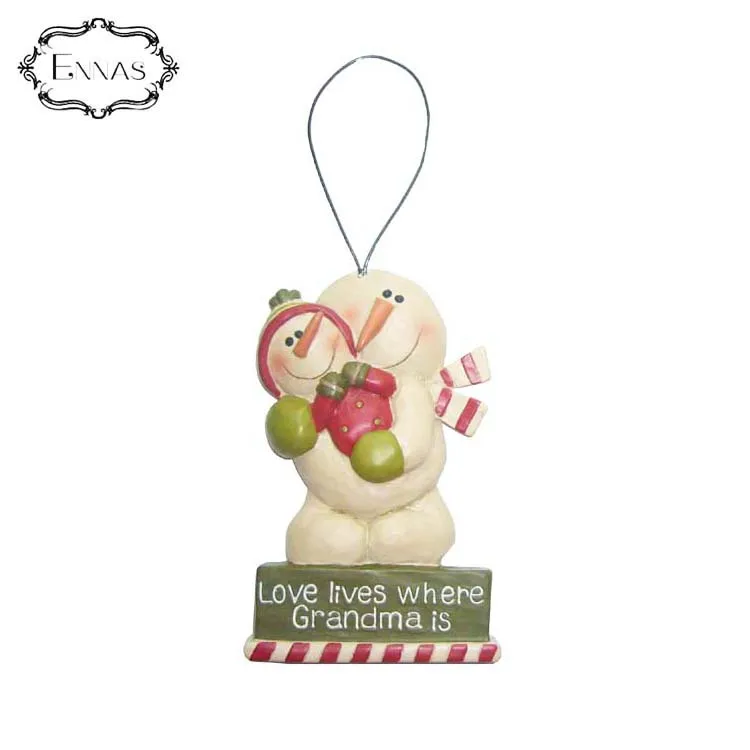 Snowman hanging christmas ornaments with love gifts