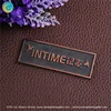 designer metal emblems handbag