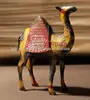 Metallic yellow color camel with red carrying back