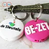 Custom design round shaped soft pvc rubber led squeeze light keychains