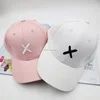 Wholesale letter embroidered X baseball cap hat hat bent hip hop character spring and summer peaked sublimation baseball cap