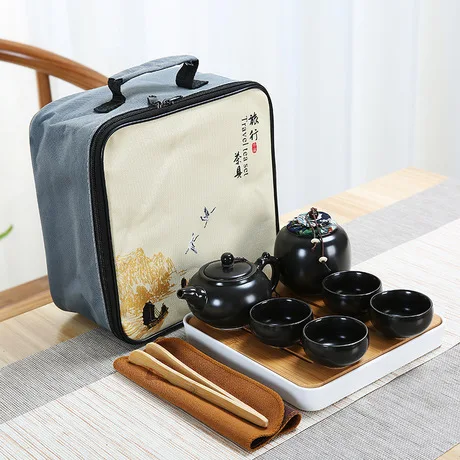 

Travel tea set: tea pot, tea cups, tea canister and tea tray, White;black and green