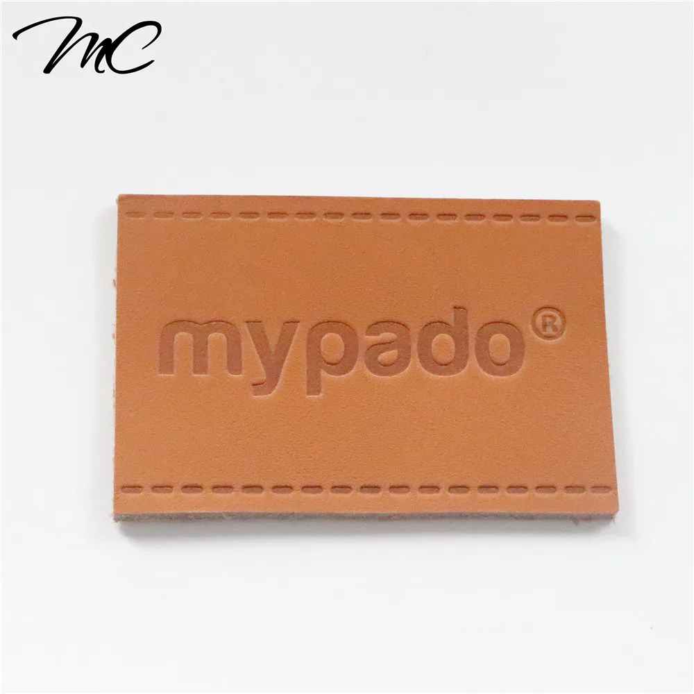 

Custom embossed logo free style private genuine leather label patch for handbags hats jeans, As your request