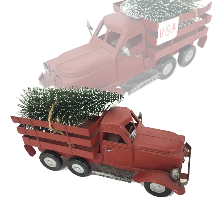red metal truck with christmas tree