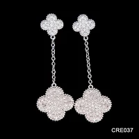 

Alibaba Duoying Jewelry Real Gold Plating White CZ Micro Pave Four Leaf Clover Jewelry Long Hanging Earrings