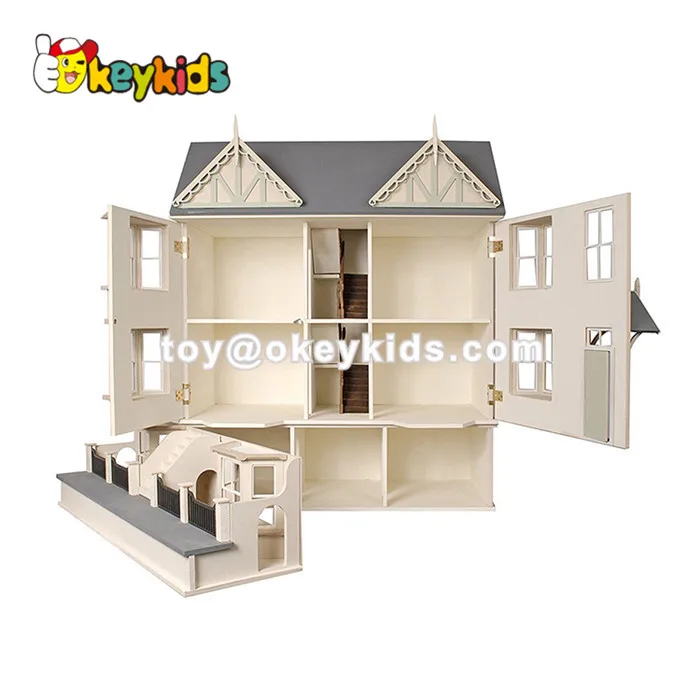 pink wooden dolls house