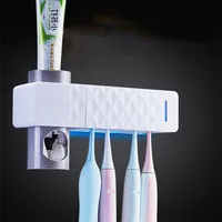 

New design plastic bathroom uv toothbrush holder Automatic toothpaste dispenser Ultraviolet Sterilizer Storage Holder