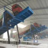 Hydraulic container unloading system truck discharger