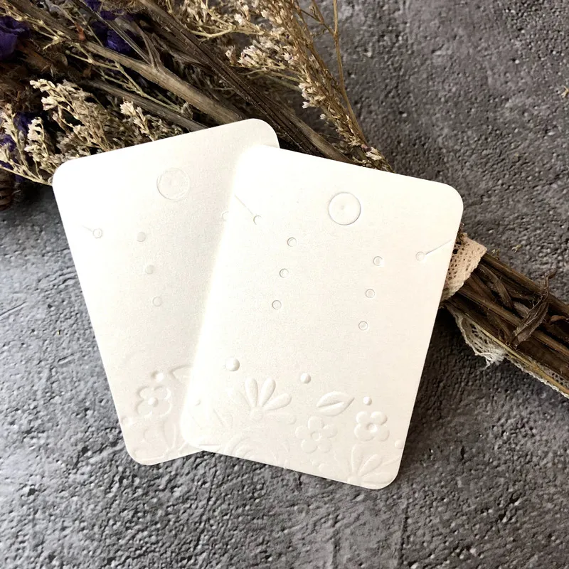 
Luxury White Pearl Paper Necklace And Stud Earring Packaging Hanging Card With Embossing Flower 